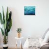 Painting of sea hanging in a room