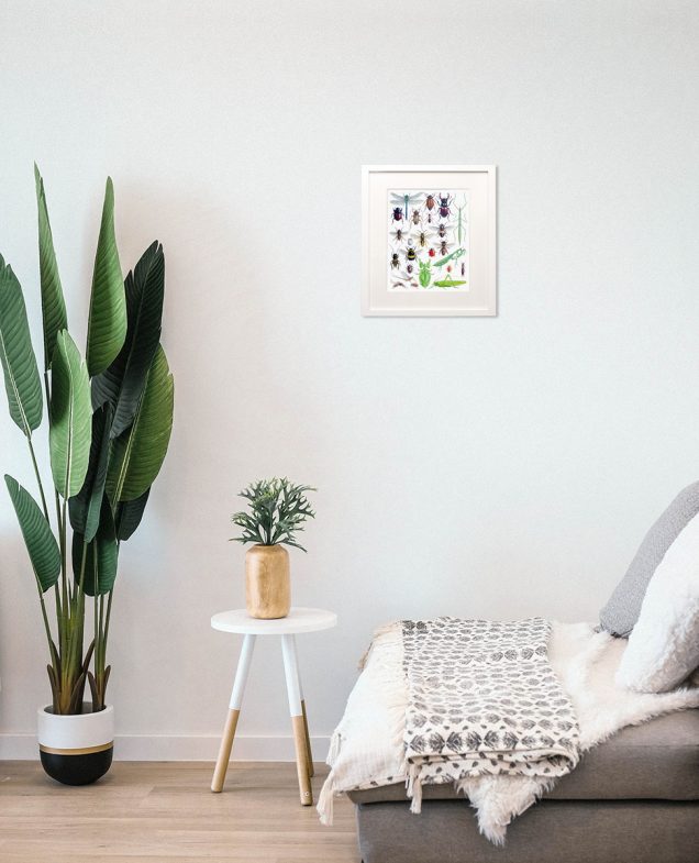Framed painting of insects hanging in a room