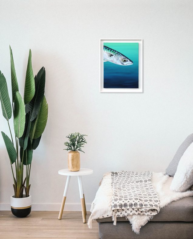 Framed painting of a Mackerel hanging in a room
