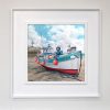 Framed painting of a fishing boat at low tide, St Ives