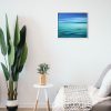 Tranquil sea painting hanging in a room