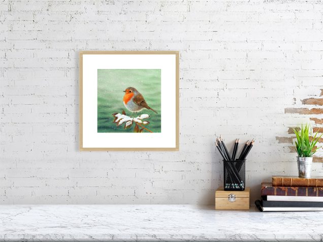 Print of a robin in an oak picture frame and white mount